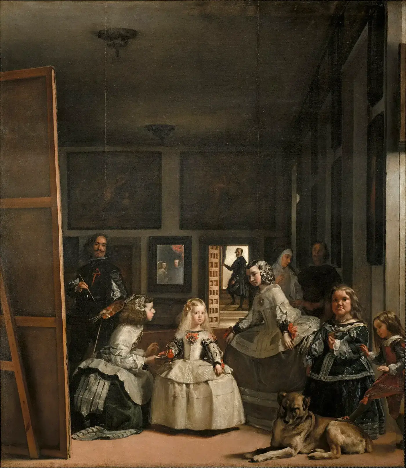 Sala alta y en penumbra del Alcázar de Madrid. A la izquierda, Velázquez ante un gran lienzo visto por su reverso; en el centro, la infanta Margarita entre dos meninas; a la derecha, dos personas de la corte y un perro; al fondo, un espejo con dos figuras y una puerta abierta con un hombre a contraluz.